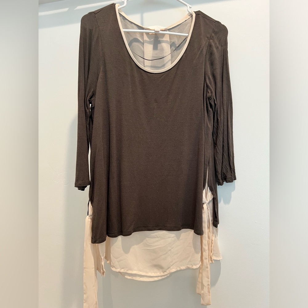Green and cream colored blouse